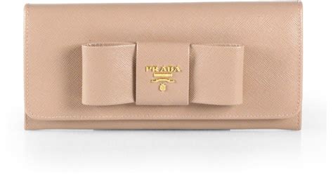 prada saffiano bow continental wallet pink